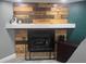 Close-up of unique, rustic fireplace and hearth showcasing the room's cozy focal point at 1631 St Mary Dr, Dunedin, FL 34698