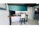 Dedicated home office space with a stylish wood desk and a comfortable chair at 1631 St Mary Dr, Dunedin, FL 34698