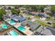 Aerial view of a home with a private backyard swimming pool and a paved patio area at 1706 Sloop Pl, Brandon, FL 33511