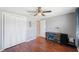 Bedroom boasts wood floors, ample closet space, and a dedicated desk area at 1706 Sloop Pl, Brandon, FL 33511