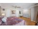 Inviting bedroom with a ceiling fan, wood floors, and a cozy rocking chair at 1706 Sloop Pl, Brandon, FL 33511