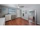 Bright bedroom with wood floors, dressers for storage, and a large mirror at 1706 Sloop Pl, Brandon, FL 33511