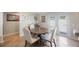 Cozy dining area featuring a round table with upholstered chairs and sliding glass doors at 1706 Sloop Pl, Brandon, FL 33511