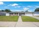 Charming single-story home featuring a well-manicured lawn and attached garage, perfect for suburban living at 1706 Sloop Pl, Brandon, FL 33511