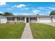 Beautifully maintained single-Gathering home with a lush green lawn and attached two car garage at 1706 Sloop Pl, Brandon, FL 33511