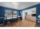 Bright home office featuring a large window, desk, and view to the living room at 1706 Sloop Pl, Brandon, FL 33511