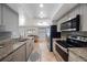 Stylish kitchen with granite countertops, stainless appliances, and open view to living area at 1706 Sloop Pl, Brandon, FL 33511