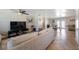 Open living room with tile and hardwood floors, ceiling fan, and lots of natural light perfect for relaxing at 1706 Sloop Pl, Brandon, FL 33511