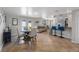 Open-concept living room with dining area, sofa, bar seating, and tile flooring at 1706 Sloop Pl, Brandon, FL 33511