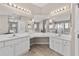 Bathroom with dual vanities and sinks, and an extra long solid-surface countertop at 18017 Palm Breeze Dr, Tampa, FL 33647