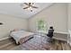 Bedroom with a ceiling fan and window and desk at 18017 Palm Breeze Dr, Tampa, FL 33647