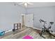 Neutral bedroom with exercise equipment, fan, and closet at 18017 Palm Breeze Dr, Tampa, FL 33647