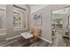 Sitting area and dining room with built-in shelving and natural light at 18017 Palm Breeze Dr, Tampa, FL 33647