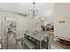 The open dining room has wood floors, and access to kitchen and office at 18017 Palm Breeze Dr, Tampa, FL 33647