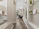 Elegant hallway features sleek wood floors and stylish built-in display shelves at 18017 Palm Breeze Dr, Tampa, FL 33647