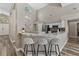 Bright kitchen with white cabinets, granite countertops, and a stylish breakfast bar with seating at 18017 Palm Breeze Dr, Tampa, FL 33647