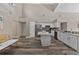 Eat-in kitchen featuring white cabinets, stainless appliances, and a center island at 18017 Palm Breeze Dr, Tampa, FL 33647