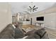 Comfortable living room with wood-look floors and a large sectional sofa at 18017 Palm Breeze Dr, Tampa, FL 33647