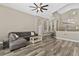 Cozy living room featuring stylish hardwood flooring, modern decor, and integrated display niches at 18017 Palm Breeze Dr, Tampa, FL 33647
