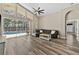 Inviting living room with sliding glass doors leading to a screened-in pool area at 18017 Palm Breeze Dr, Tampa, FL 33647
