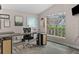 This office features neutral tones, natural light, and an office chair with room to work at 18017 Palm Breeze Dr, Tampa, FL 33647