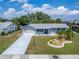 Aerial view of the charming home with well-manicured landscaping at 1813 Allegheny Dr, Sun City Center, FL 33573