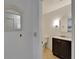 Bright bathroom with subway tile walls and a dark vanity with white countertop at 1813 Allegheny Dr, Sun City Center, FL 33573
