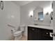 Bright bathroom featuring white subway tile and a dark vanity with white countertop at 1813 Allegheny Dr, Sun City Center, FL 33573