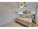 Well-lit bedroom featuring a ceiling fan, soft neutral tones, and large window at 1813 Allegheny Dr, Sun City Center, FL 33573