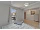 Bedroom boasts tiled floor, natural lighting, and a view to an adjacent bonus room at 1813 Allegheny Dr, Sun City Center, FL 33573