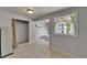 Versatile bonus room with tiled floors, closet, and mini-split A/C system at 1813 Allegheny Dr, Sun City Center, FL 33573