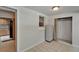Bonus room with walk-in closet featuring tiled floor and adjacent eat-in kitchen at 1813 Allegheny Dr, Sun City Center, FL 33573