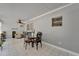 Dining area featuring tile floors, ceiling fan and table setting with seating for four at 1813 Allegheny Dr, Sun City Center, FL 33573