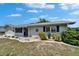Charming home featuring a well-maintained front yard with flowerbeds at 1813 Allegheny Dr, Sun City Center, FL 33573