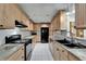 Well-equipped kitchen with granite countertops and ample cabinet space at 1813 Allegheny Dr, Sun City Center, FL 33573