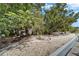 Lush landscaping, including trees and shrubbery, is present in the yard at 1813 Allegheny Dr, Sun City Center, FL 33573