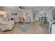 Inviting living room with plush seating, modern decor, and ample natural light at 1813 Allegheny Dr, Sun City Center, FL 33573