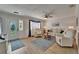 Bright living room featuring plush seating, new floors, and plenty of space at 1813 Allegheny Dr, Sun City Center, FL 33573