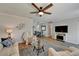 Cozy living room with neutral decor, adjacent to a dining area at 1813 Allegheny Dr, Sun City Center, FL 33573