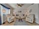 Comfortable living room with neutral tones, ceiling fan, and modern decor at 1813 Allegheny Dr, Sun City Center, FL 33573