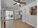 Bright office with wood floors, desk, shelving, glass paneled doors and large windows at 1813 Allegheny Dr, Sun City Center, FL 33573
