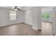 Bedroom with hardwood floors, ceiling fan, and window with shutter at 19238 Old Spanish Rd, Tampa, FL 33647