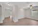 Spacious living room with hardwood floors, a ceiling fan, and natural light at 19238 Old Spanish Rd, Tampa, FL 33647