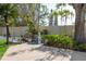 Landscaped backyard nook with a water feature and mature plantings offers a peaceful retreat at 2010 Bayview Pl, Indian Rocks Beach, FL 33785