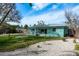 Charming backyard boasts a well-kept lawn, pea gravel, and tidy landscaping at 2010 Bayview Pl, Indian Rocks Beach, FL 33785