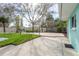 Backyard featuring a concrete patio, well-maintained lawn, and beautiful landscaping offers a tranquil setting at 2010 Bayview Pl, Indian Rocks Beach, FL 33785