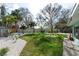 Sprawling backyard featuring pea gravel, grass, and concrete areas provides a versatile outdoor living space at 2010 Bayview Pl, Indian Rocks Beach, FL 33785
