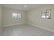 Bedroom with a ceiling fan, two windows and light paint at 2010 Bayview Pl, Indian Rocks Beach, FL 33785