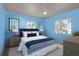 This staged bedroom features a large window, ceiling fan and is brightly lit at 2010 Bayview Pl, Indian Rocks Beach, FL 33785