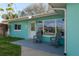 Inviting front porch seating with stylish chairs perfect for relaxing outdoors at 2010 Bayview Pl, Indian Rocks Beach, FL 33785